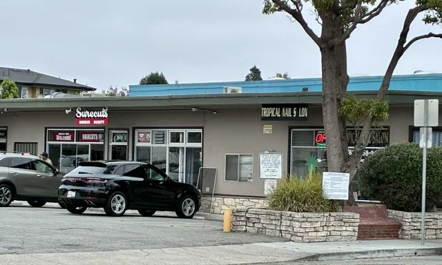 Surecuts and Tropical Nail Salon storefronts at Seabright Plaza